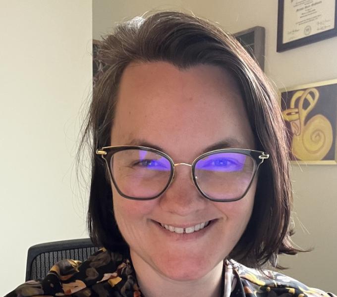 headshot of Dr McGovern in her office with glasses